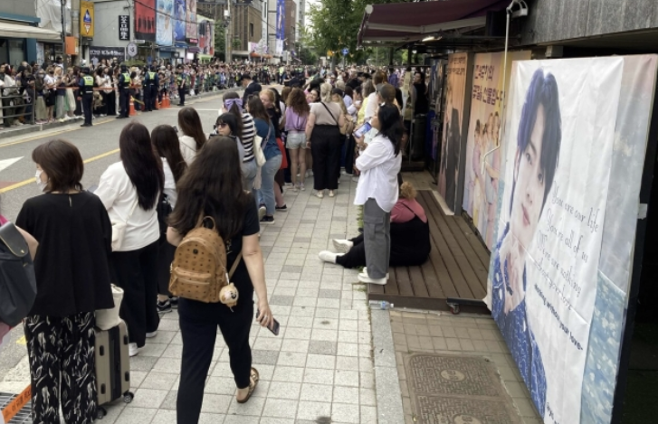 Fans showing support near the military discharge site