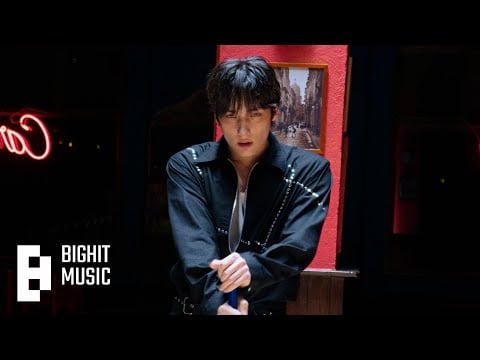 TXT's Hueningkai wanders the city in the music video for "Dance With You"