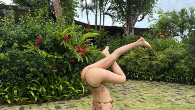 Lisa in bikini showing flexibility