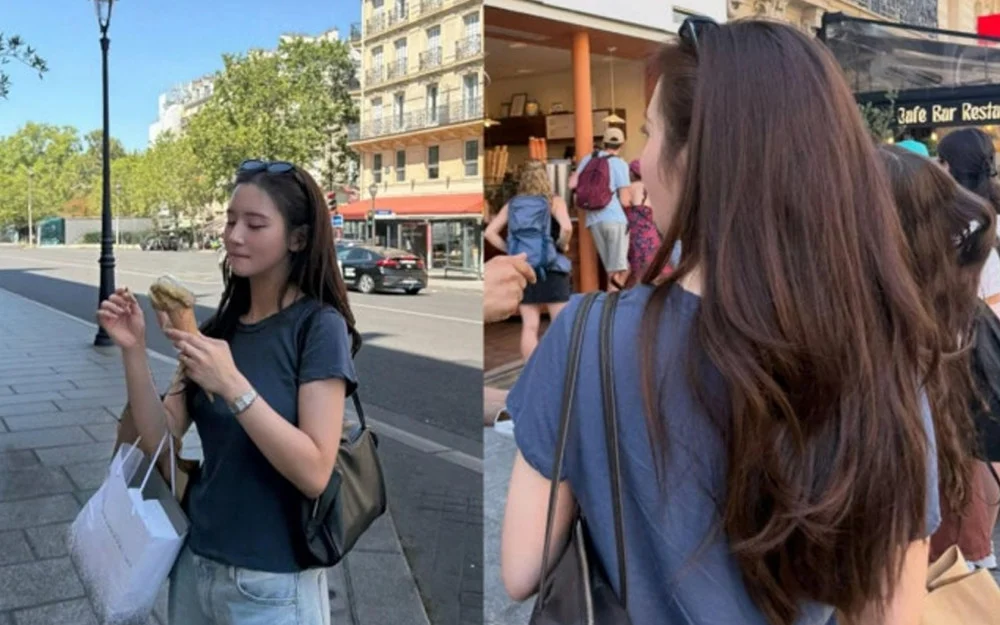 Han Seo Hee in navy T-shirt and jeans on Paris street