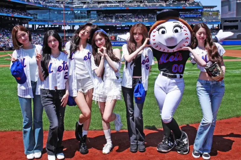 IVE walking into Citi Field wearing custom Mets jerseys and smiles