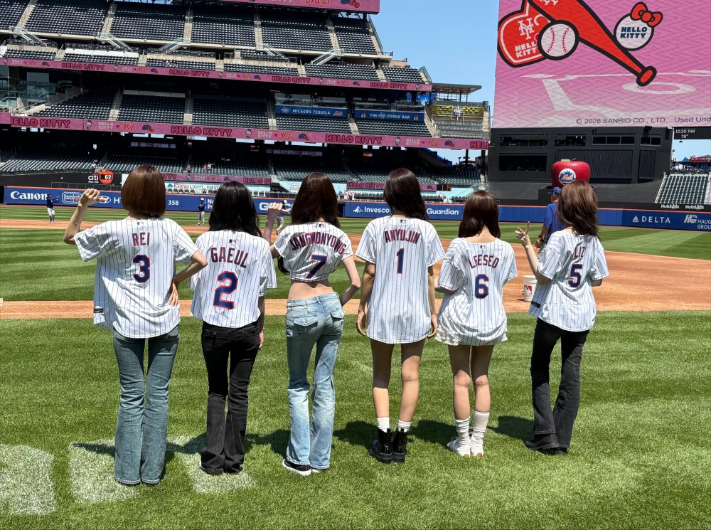 IVE group posing with fans near Citi Field entrance