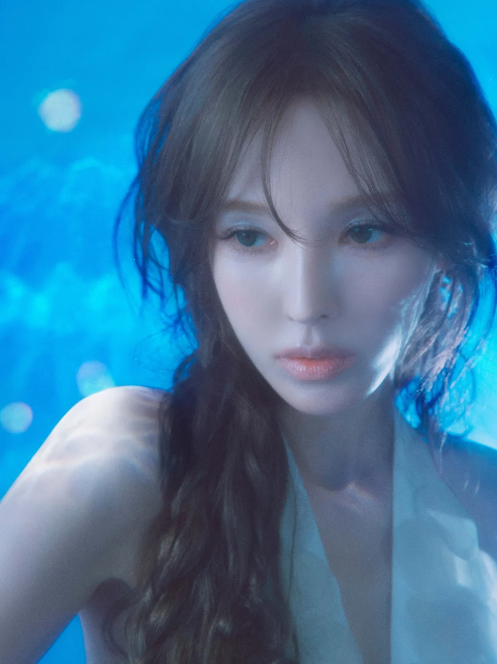 portrait highlighting ethereal styling and submerged color palette