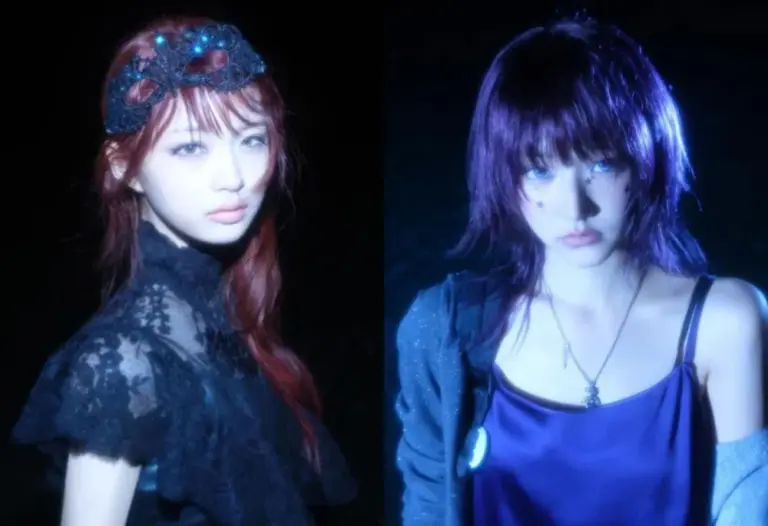 KiiiKiii members posed under soft blue-hued lighting in night setting